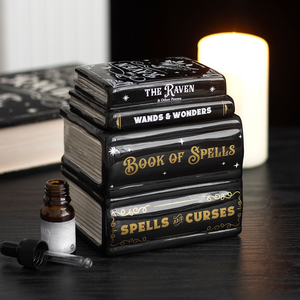 quemador de wax melts en forma de libro de hechizos